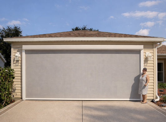 Motorized garage door screen installed in Clermont Florida home providing privacy and ventilation